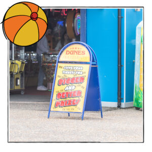 Paid Search Management preview image featuring a sign in front of a fun fair hall.